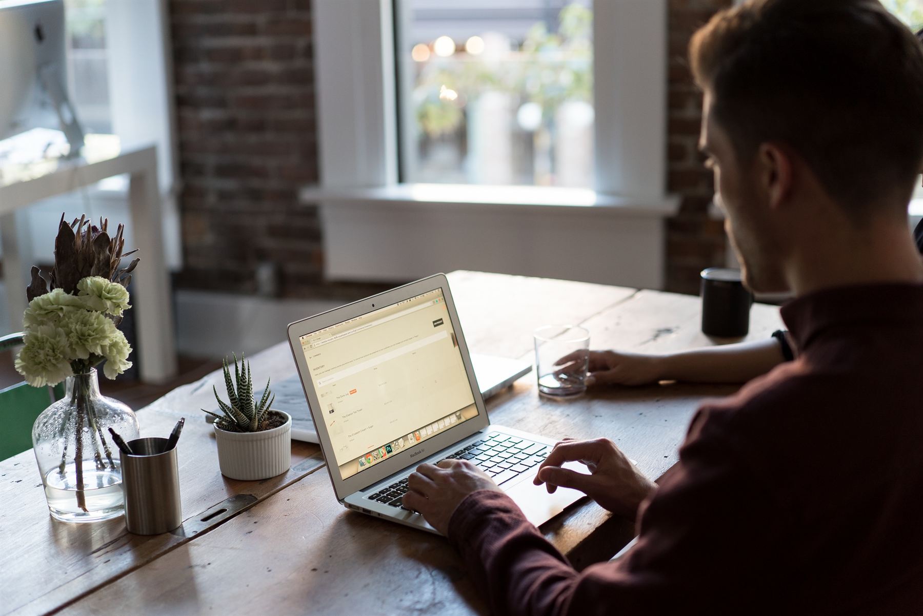 Designer building a website on a laptop